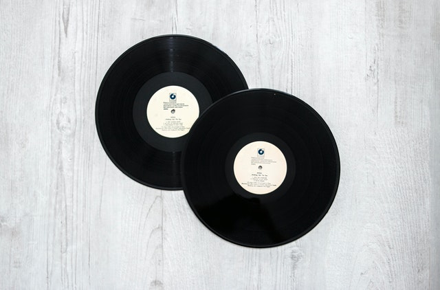 photography-of-vinyl-records-on-wooden-surace-1021876.jpg